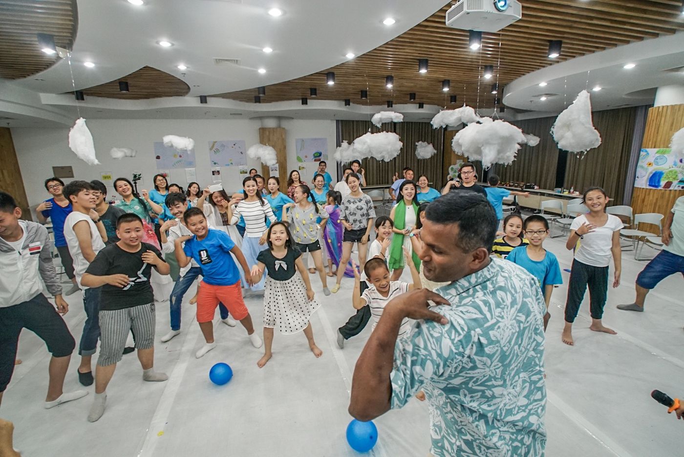Jay leading a joyful movement session with families in China